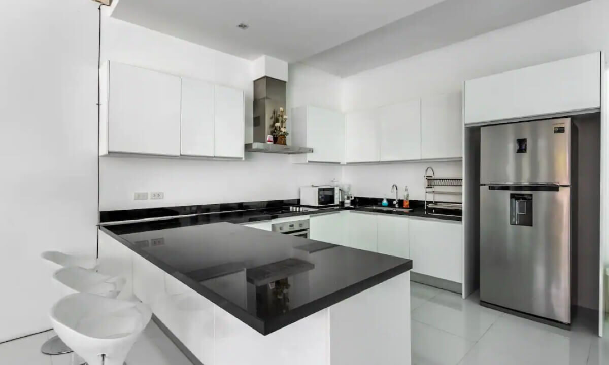 4_to_5_bedroom_modern_pool_villa_for_sale_from_owner_10_minutes_walk_kamala_beach_phuket_thai_residential_kitchen_island_breakfast_bar
