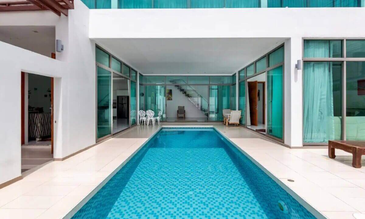 4_to_5_bedroom_modern_pool_villa_for_sale_from_owner_10_minutes_walk_kamala_beach_phuket_thai_residential_pool_deck_hallway